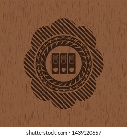 three folders icon inside realistic wooden emblem
