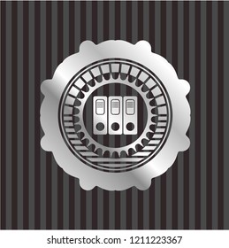 three folders icon inside silver badge or emblem