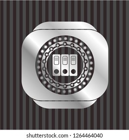three folders icon inside silvery shiny emblem