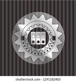 three folders icon inside silvery emblem