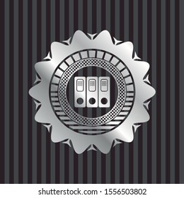 three folders icon inside silvery shiny badge