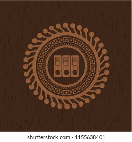 three folders icon inside wood emblem. Retro