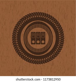 three folders icon inside wood badge or emblem