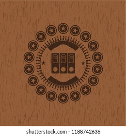 three folders icon inside wood emblem