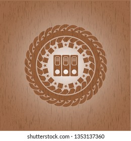 three folders icon inside wood emblem. Retro
