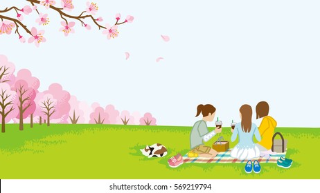 Three girls picnic in spring nature