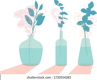 three glass vases with flowers