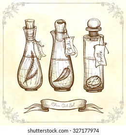Three glass vintage bottle with olive  oil. Rosemary olive oil, chili olive oil, truffle olive oil.
