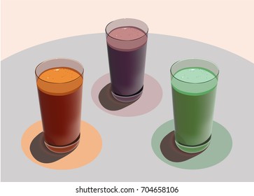 three glasses with freshly squeezed juices on a table