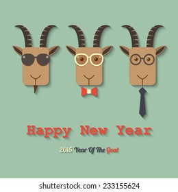 three goats wearing glasses with 2015 year of the goat sign. vector.