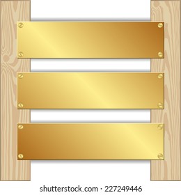 three golden plaques nailed to wooden planks