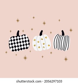 Tres calabazas de Halloween con brillo de oro. Diseño minimalista y colores agradables.