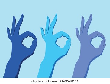 Three hands in blue shades show the sign ok
