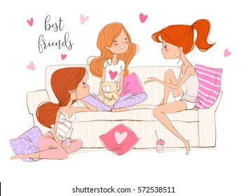 Three happy girls sitting on couch and having a talk