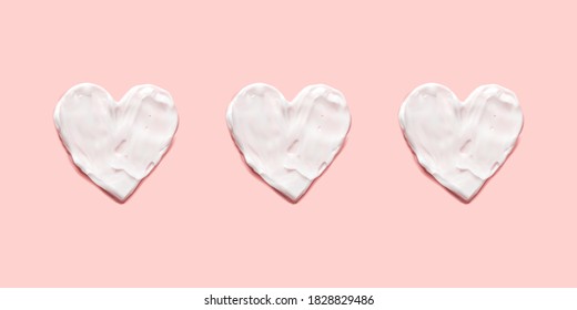 Three heart shapes from cream in pink background vector realistic illustration.  Beauty skin care product texture