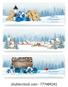 Tres pancartas navideñas navideñas con un pueblo de invierno y cajas de regalo y 2018. Vector