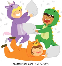 Three Kids Having A Pillow Fight While Wearing Animal Onesie Jumpsuits In A Slumber Party.