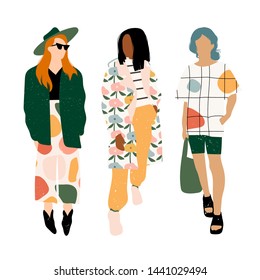 Three ladies dressed in trendy clothes standing in various poses. Fashion look.  Female faceless characters. Hand drawn colored vector set. All elements are isolated