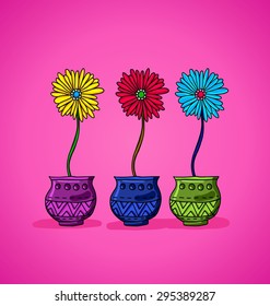 three large bright flowers in pots on pink background