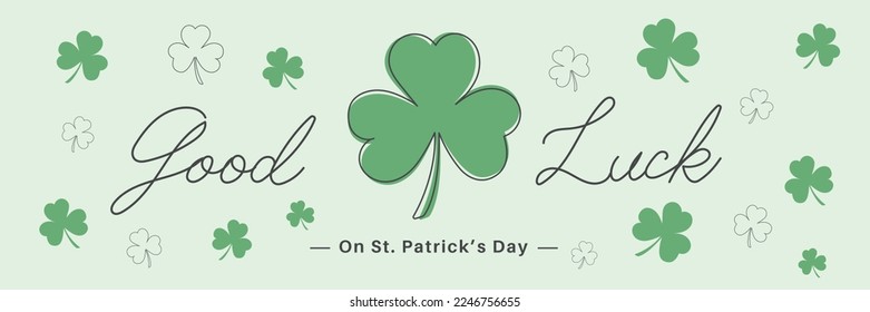 three leaf clover and many small clovers Good Luck on Saint Patrick's Day banner with handwritten typography lettering line design 