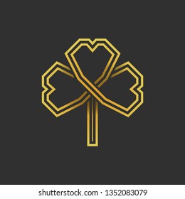 Three leaf gold shamrock in Celtic style, St Patrick's day vector clover icon on dark gray background