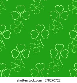 Three leaves clover dotted Seamless Pattern. Floral green background. St. Patrick's day symbol. Abstract background. Vector Illustration.