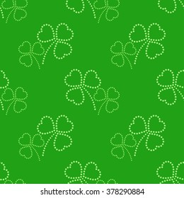 Three leaves clover dotted Seamless Pattern. Floral green background. St. Patrick's day symbol. Abstract background. Vector Illustration.