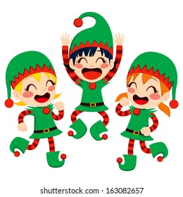 Three little children dressed in Santa Claus Helpers costume dancing happy on Christmas Eve time