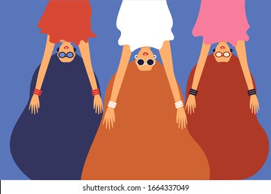 Three long haired women in upside down position. 