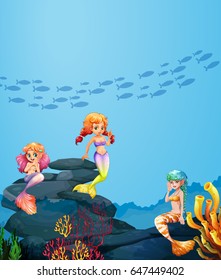 Three mermaids swimming under the ocean illustration