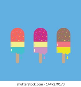 Three multicoloured ice-lollies on wooden lollipop sticks with a sky blue background.
