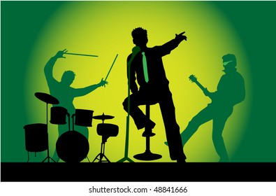 The three musicians on stage - a concert, green background