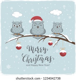 Three owls with Santa's hat on branch with snow and red Christmas balls. Lettering Merry Christmas and Happy New Year on winter background, illustration.