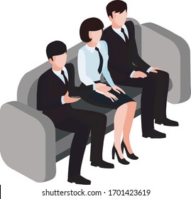 tres personas sentadas en un sofá de la oficina