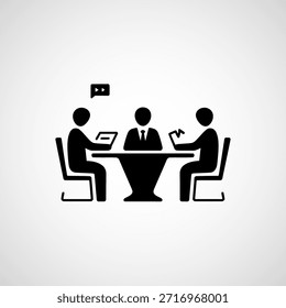 Three people sitting at a table with a laptop and papers