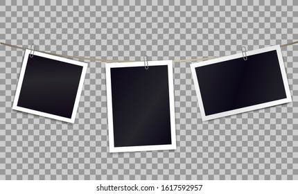 Three photorealistic blank retro photo frames attached metal paper clips on tape. Template for design. Vector illustration