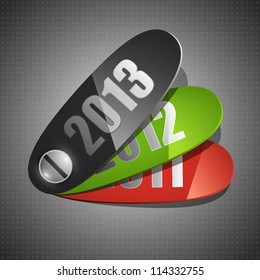 Three plastic stickers on gray background. New year 2013 concept.