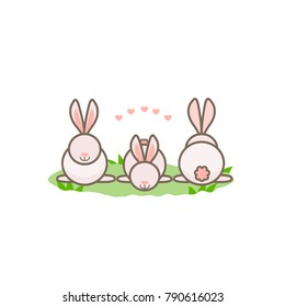 Three rabbits in the field. 