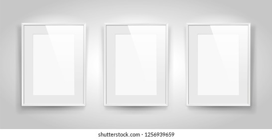 Three realistic empty rectangular white frames with passepartout on gray background, border for your creative project, mock-up sample, picture on the wall, vector design object