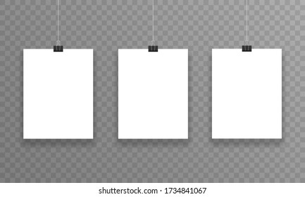 Three realistic sheets of paper hanging on paper clips on a transparent background. Vector illustration.