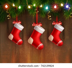 Three red christmas stockings hanging on fir twig at wooden wall background realistic vector Illustration