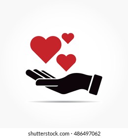 three red love shapes on a black hand with shadow effect, giving loves illustration.