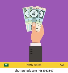Three riyal in hand. Saudi Arabian riyal banknote vector illustration.