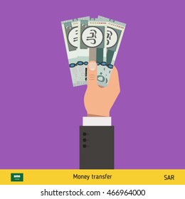 Three riyal in hand. Saudi Arabian riyal banknote vector illustration.