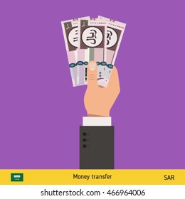 Three riyal in hand. Saudi Arabian riyal banknote vector illustration.