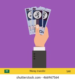 Three riyal in hand. Saudi Arabian riyal banknote vector illustration.