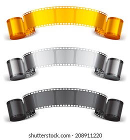 Three scrolls of color movie tapes.