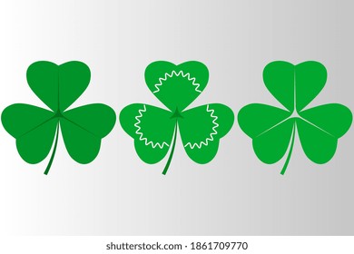 Three shamrocks on a gray shimmering background, horizontal. St.Patrick 's Day.