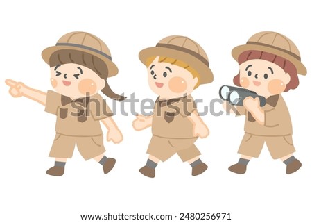 Three smiling children walking around in explorer clothes.