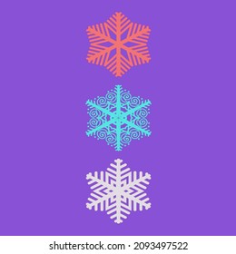 Tres copos de nieve de diferentes colores sobre un fondo morado.